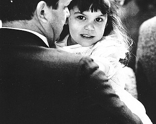 FAMILY AFFAIR: Bill Kinnick of Hubbard held his daughter, Adrienne, 3, during services at St. Patrick Church in Hubbard...Photo taken April 19, 1987...Photo by Patricia L. Fife Ð The Vindicator