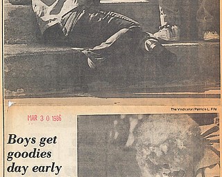 BOYS GET GOODIES DAY EARLY Ð The long-awaited day has finally arrived with area children waking to find Easter baskets filled with chocolate eggs and bunnies and maybe even a jelly bean or two.  Two area boys didn't wait until today to begin the festivities.  Scott Hays, 5, left and his big brother Patrick 7, of 1725 Midland St., Saturday spent some time on their front stoop playing with their Easter bunnies.  The boys were too busy playing with the bunnies to come up with names for them yet.   David Pavlich, 3, the son of Mr. and Mrs. Milan Pavlich didn't wait until today to begin the fun either.  "Applejack," an Aut Mori Grotto Clown helped David find some goodies at Saturday's Austin Woods Easter egg hunt.  When "Applejack" isn't adorned with his curly wig and jumpsuit, he's better known as Jack Hargate.  "Applejack" lent a hand to many of the eager hunters...Photos taken March 29, 1986...Photos by Patricia L. Fife and William D. Lewis - The Vindicator .....