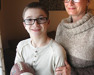 William D. Lewis The vindicator Peyton Switka who has cystic fibroisis and plays a number of sports, and his mother Shannon Switka in their Boardman home 3-27-18.