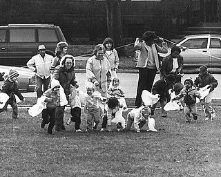 LET'S GO - Some 200 area preschool children raced for treats Tuesday at Wick Park during the Youngstown Park & Recreation Commission's 26th annual Easter egg hunt.  

Photo taken March 25, 1986.  

Photo by William D. Lewis - The Vindicator.