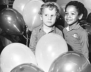 BALLOONS GALORE - Robert Buranich and John Patterson, 5-year-old students at the Mill Creek Child Care Center, are trapped in a maze of balloons.  The Boardman-Poland Junior Women's League recently came to the center bearing the balloons and Easter baskets. 

Photo from March 26, 1986.  

Photo by Lloyd S. Jones - The Vindicator.