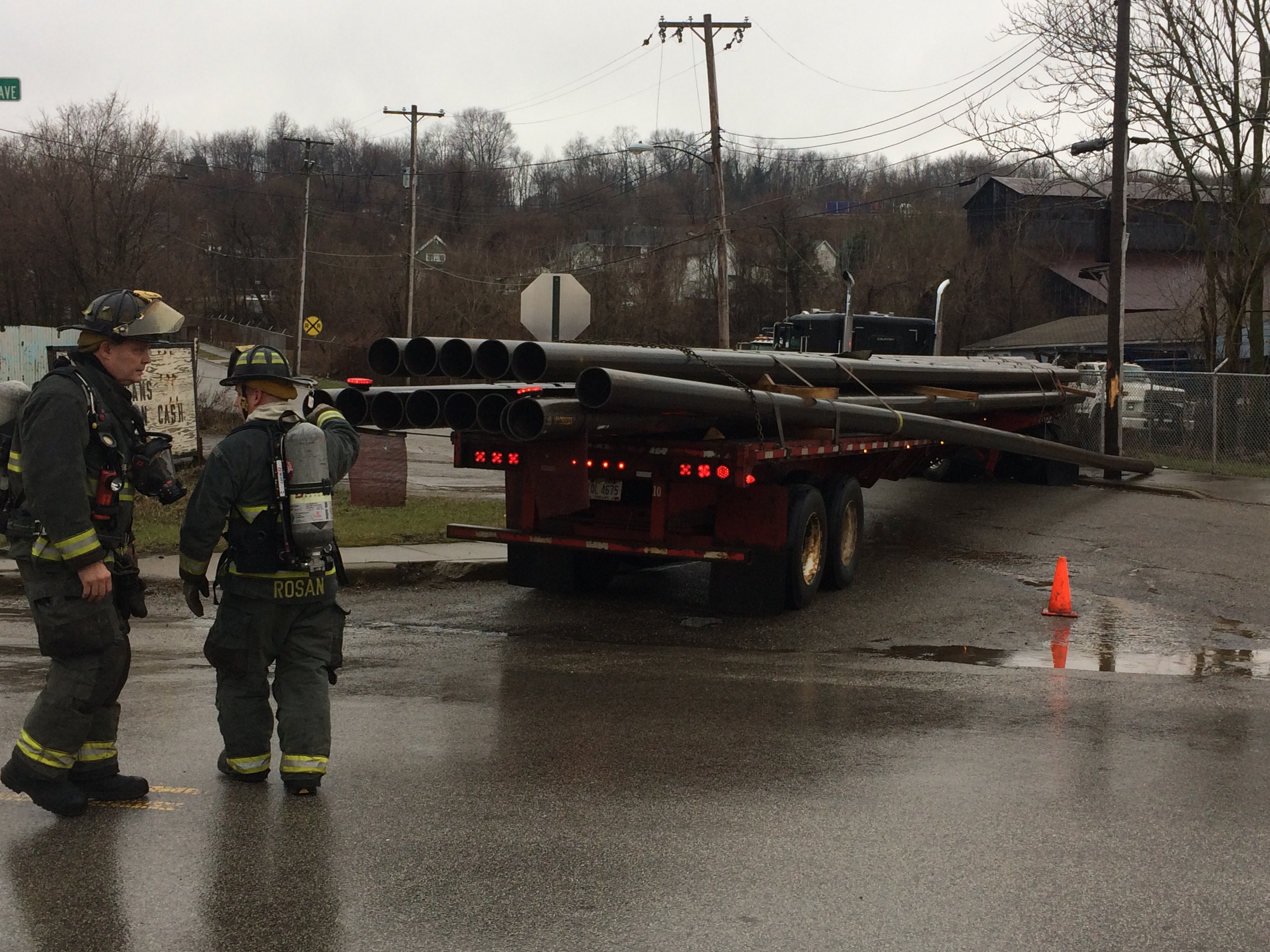 Poland Avenue is closed at Powersdale Avenue after this truck carrying steel pipes struck a pole.