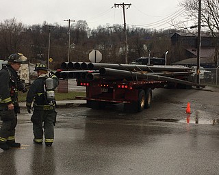 Poland Avenue is closed at Powersdale Avenue after this truck carrying steel pipes struck a pole.