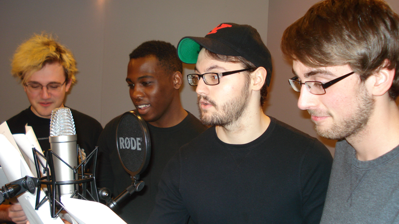 Four Youngstown State University students rehearse for next week’s Good Humor Radio Players show. They are, from left, Ben Mowrer, DJ Davis, Mason Edmunds and David Leach.
