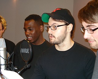 Four Youngstown State University students rehearse for next week’s Good Humor Radio Players show. They are, from left, Ben Mowrer, DJ Davis, Mason Edmunds and David Leach.
