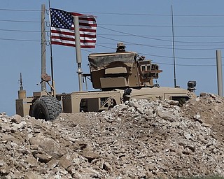 With allies anxious about a hasty U.S. withdrawal, the Trump administration said it would stay in war-torn Syria to finish off the job of defeating the Islamic State group and was committed to eliminating the militants’ “small” presence that “our forces have not already eradicated.”