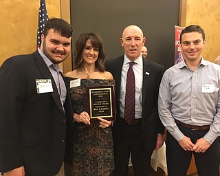 Neighbors | Submitted .Bill and Karen Veri were awarded the  Boardman Civic Association’s Community Service Award. Pictured are, Karen Veri with son Anthony, Boardman Schools Superintendent Tim Saxton and Booster President Bruce Flyak.