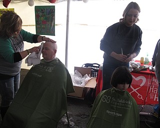 Neighbors | Zack Shively.Pictured are, from left, Mary Christ and Emily Suschinsky at O'Donald's Pub and Grill's Head Shaving event. Christ shaved her head and Suschinsky donated a ponytail of her hair. Suschinsky donated for a family friend with neuroglioma.