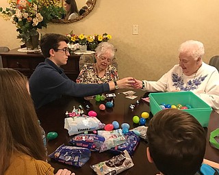 Neighbors | Submitted.Volunteers from Poland Middle School's seventh- and eighth-grade student council helped fill 2,800 plastic eggs with assistance from residents of the Blackburn Home. The organizations have partnered for the project annually over the last three years.