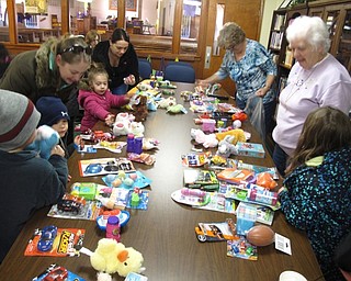 Neighbors | Zack Shively.Among the eggs that Heritage Presbyterian Church hid, some had prize tickets, which could be exchanged for toys. They split the toys up by age range like they did for the egg hunt.