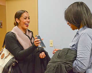 Monica Bonilla, left, B. Sisters Photographer entrepreneur, networks with Jessica Lynne, independent consultant with Paparazzi Accessories, at the Women in Entrepreneurship Center opening at Youngstown Business Incubator on Thursday April 5, 2018.

Photo by Scott Williams - The Vindicator