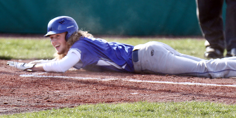 Poland's Reed McCreery(5) scores during 1rst inning of 4-5-18 game with Struthers at Cene.

William D. Lewis The Vindicator 