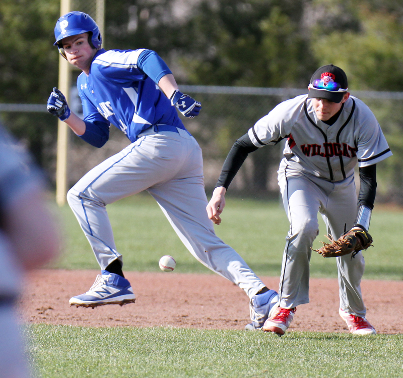 Poland's Zachary Yaskulka(44) breaks for 3 rd as Struthers SS Kevin Caldwell(10) tries to field a ground ball during 4-5-18 action at Cene.

William D. Lewis The Vindicator 