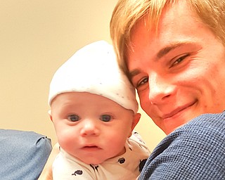 Tyler Squarebrigs of Naples, Fla., embraces his son, Roland Hahn. Roland's mother, Anita Hahn of Austintown, is charged with child endangerment, and Squarebrigs won custody of the child.