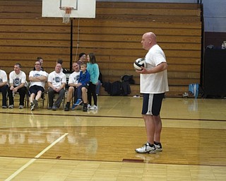 Neighbors | Zack Shively.The PTA of Glenwood Junior High School organized the volleyball championship to raise money for the PTA and events they sponsor. Pictured, Student Resource Officer Phil Merlo set up to serve the volleyball.
