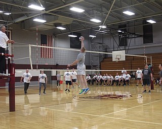 Neighbors | Zack Shively.The students of Glenwood Junior High School signed up to participate in a volleyball tournament that they played in after school. On March 22, the top two teams from the seventh grade and eighth grade played. The school's PTA also invited teachers and Boardman Police to the event to give it a community feel. Pictured, principal Bart Smith jumped up to get the volleyball.