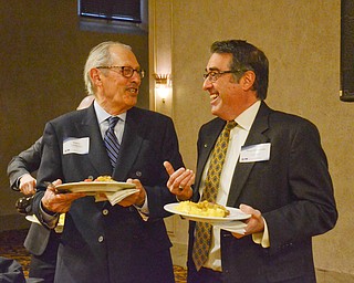 Rodney Lamberson, left, Youngstown architect, and Perry Chickonoski, founder of Unleashed Healing Center, share a laugh at the Youngstown/Warren Regional Chamber of Commerce's "Good Morning, Youngstown" breakfast at Stambaugh Auditorium on Friday, April 6, 2018.

Photo by Scott Williams - The Vindicator