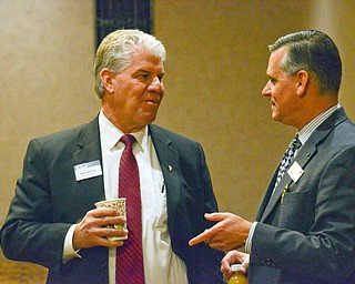 Mark Wenick, left, Board of Director, chats with Michael Schrock, Chemical Bank regional president, at the Youngstown/Warren Regional Chamber of Commerce's "Good Morning, Youngstown" breakfast at Stambaugh Auditorium on Friday, April 6, 2018.

Photo by Scott Williams - The Vindicator