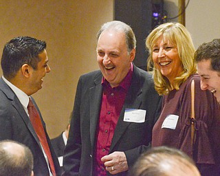 From left to right, Krish Mohip, Bert Cene, Cyndy Bresnahan, and Nick Santucci share a laugh at the Youngstown/Warren Regional Chamber of Commerce's "Good Morning, Youngstown" breakfast at Stambaugh Auditorium on Friday, April 6, 2018...Photo by Scott Williams - The Vindicator.