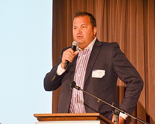 Eric Ryan, President of JAC Management Group, discusses The Youngstown Riverfront Park and Amphitheater project at the Youngstown/Warren Regional Chamber of Commerce's "Good Morning, Youngstown" breakfast at Stambaugh Auditorium on Friday, April 6, 2018.

Photo by Scott Williams - The Vindicator