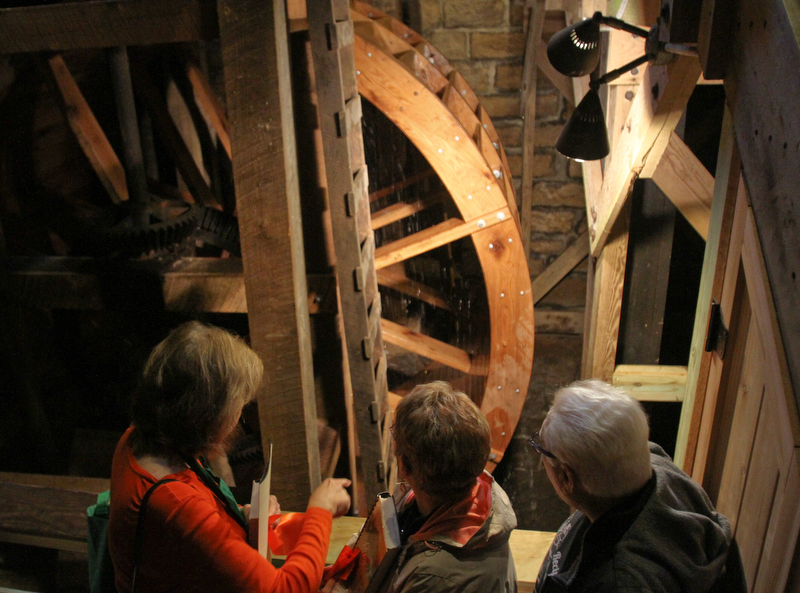 William D. Lewis the Vindicator   Spectators stand near the newly restored waterwheel at Lantermans Mill.  ribbon cutting ceremony was held 4-6-18.