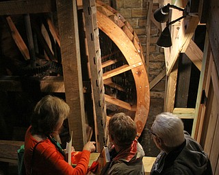 William D. Lewis the Vindicator   Spectators stand near the newly restored waterwheel at Lantermans Mill.  ribbon cutting ceremony was held 4-6-18.