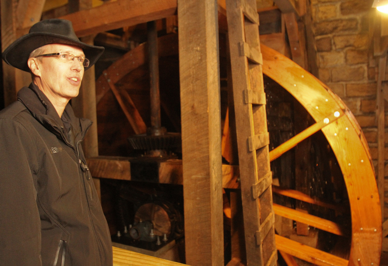 William D. Lewis the Vindicator   Steve Avery Mill Creek Park Planning and Operations Director stands near the newly restored waterwheel at Lantermans Mill.  ribbon cutting ceremony was held 4-6-18.