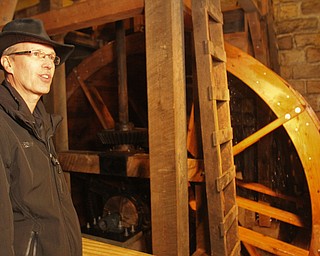 William D. Lewis the Vindicator   Steve Avery Mill Creek Park Planning and Operations Director stands near the newly restored waterwheel at Lantermans Mill.  ribbon cutting ceremony was held 4-6-18.