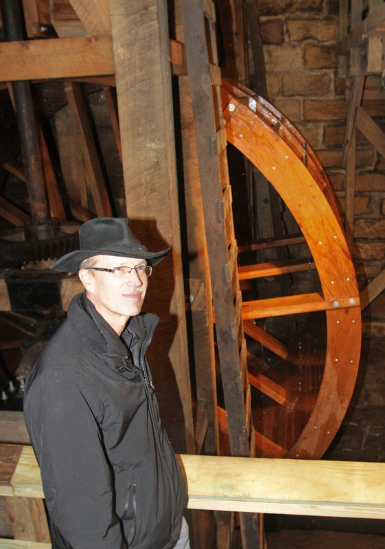 William D. Lewis the Vindicator   Steve Avery Mill Creek Park Planning and Operations Director stands near the newly restored waterwheel at Lantermans Mill.  ribbon cutting ceremony was held 4-6-18.