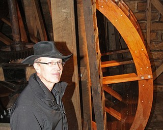 William D. Lewis the Vindicator   Steve Avery Mill Creek Park Planning and Operations Director stands near the newly restored waterwheel at Lantermans Mill.  ribbon cutting ceremony was held 4-6-18.