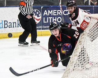 William D. Lewis The Vindicator Phantoms Curtiss Hall(20) and Steel's Hunter Johannes(14) go for the puck during 1rst period action 4-6-18 at Covelli.