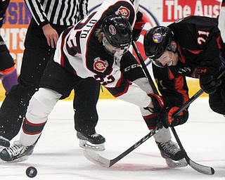 William D. Lewis The Vindicator Phantoms Michael Regush(21)) and Steel's Eric Otto(23) go for the puck during 1rst period action 4-6-18 at Covelli.