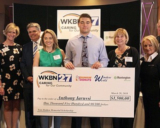 The WKBN-TV 27 Caring for Our Community campaign recently accounced the winners of the Tom Holden Memorial Scholarship contest at a luncheon at The Upstairs Restaurant. Above, from left, are Dave Sess of WKBN; Sandy Upperman of Huntington Bank; Stan Boney of WKBN; Mandy Noell of WKBN; Anthony Iarussi, winner, of Struthers High School; Angie Moran of Window World; Hilda Elash of Huntington Bank; and William Shivers of Huntington Bank.