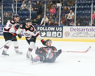 Youngstown Phantom #17, Joey Abate, goes for a ride on the ice after being tripped by Chicago Steel #26, Aaro Vidgren, as Chicago Steel #25, Samuel Bucek, watches on at the Youngstown Phantoms vs. Chicago Steel hockey game at Covelli Centre on Saturday April 7, 2018.

Photo by Scott Williams - The Vindicator