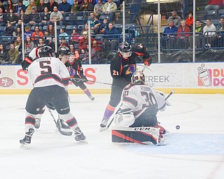 Chicago Steel #30, Justin Robbins, narrowly stops Youngstown Phantom #21, Michael Regush, from putting the puck in the net at the Youngstown Phantoms vs. Chicago Steel hockey game at Covelli Centre on Saturday April 7, 2018.

Photo by Scott Williams - The Vindicator