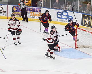 Youngstown Phantom #6, Max Ellis, puts one past Chicago Steel #30, Justin Robbins, to put the Phantoms on the board at the Youngstown Phantoms vs. Chicago Steel hockey game at Covelli Centre on Saturday April 7, 2018.

Photo by Scott Williams - The Vindicator