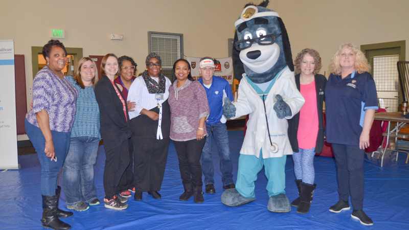 Mascot Dr. Health E. Hound poses with members of the Youngstown City Health District who volunteered at the Citywide Baby Shower at the Eugenia C. Atkinson Recreational Center. Saturday’s event focused on letting young mothers, and those expecting, learn about the community resources available to help them care for their babies. The shower also included a health fair.