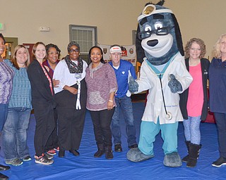 Mascot Dr. Health E. Hound poses with members of the Youngstown City Health District who volunteered at the Citywide Baby Shower at the Eugenia C. Atkinson Recreational Center. Saturday’s event focused on letting young mothers, and those expecting, learn about the community resources available to help them care for their babies. The shower also included a health fair.