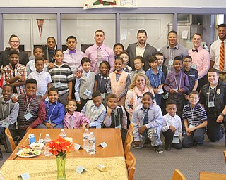 A group of Youngstown State University men come to Williamson Elementary School on Youngstown’s South Side twice monthly for a “gentlemen’s” meet and lunch event with male students. The idea is to provide positive male role models for young boys and teach them proper etiquette.