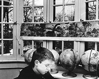 NEW WORDS, NEW WORLDS: Eight-year-old Josh Micholojko improves his dictionary skills.  Kennedy students range in age from four to 14.

Photo taken April 8, 1987.

Photos by Robert DeMay - The Vindicator.