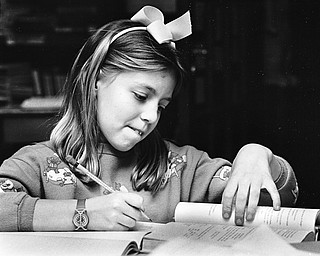 TOUGH SUBJECT: Heidi Duff, a middle school student at The Kennedy School for the Gifted on Broadway Avenue in Youngstown, ponders math problems.

Photo taken April 8, 1987.

Photo by Robert DeMay - The Vindicator