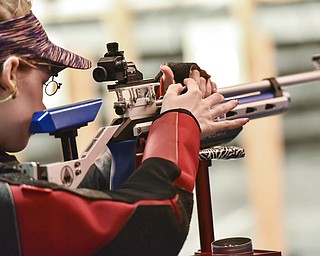 In Dahlonega, Ga., a student stands at the bay of a gun range at the University of North Georgia, carrying an air rifle and wearing specialized glasses. In the wake of the shooting at a high school in Parkland, Fla., some Americans are questioning whether school gun clubs are wise. But those who participate say it teaches them discipline, patience and life skills.