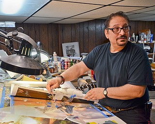 Artist Raymond Simon shows off some of his latest works at his home studio in Canfield.  He has created an image that will be used on a Mahoning Valley Middle East Memorial at Wickliffe Circle in Austintown.

Photo by Scott Williams - The Vindicator