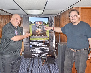 Artist Raymond A. Simon, right, and Tony Revetti, left, show off a drawing of what will become the Mahoning Valley Middle East Memorial at Wickliffe Circle in Austintown.  Revetti is spearheading the memorial's construction.

Photo by Scott Williams - The Vindicator
