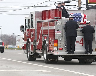  ROBERT K.YOSAY  | THE VINDICATOR.. over 150 cars were in the procession which the firetruck carried the body of chief randall pugh - the procession went south on 46 from mineral ridge to Greenhaven funeral home in canfield.funeral of Weathersfield Township Fire Chief Randall Pugh, who died April 2..-30-