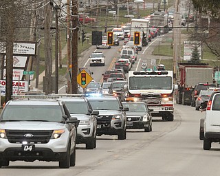  ROBERT K.YOSAY  | THE VINDICATOR.. over 150 cars were in the procession which the firetruck carried the body of chief randall pugh - the procession went south on 46 from mineral ridge to Greenhaven funeral home in canfield.funeral of Weathersfield Township Fire Chief Randall Pugh, who died April 2..-30-