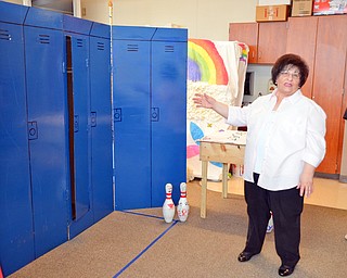 Ms. Jeanne Constantino, the advisor of Destination Imagination group at East East School, shows off the groups skit props on Monday, April 9, 2018.

Photo by Scott Williams - The Vindicator