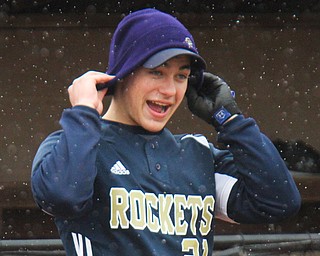 William D. Lewis The Vindicator   Lowellville's Vinnie Kacir(21) puts on a stocking cap during snowy conditions in4-9-18 game with Western Reserve at Cene.