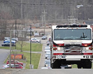 WEATHERSFIELD, OHIO - APRIL 9, 2018: A Weathersfield fire truck transporting Weathersfield Township Fire Chief Randall Pugh's casket drives, after the conclusion of his funeral, Monday morning. DAVID DERMER | THE VINDICATOR