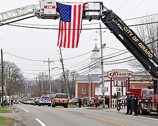 WEATHERSFIELD, OHIO - APRIL 9, 2018: The funeral procession for Weathersfield Township Fire Chief Randall Pugh drives on Route 46, Monday morning. DAVID DERMER | THE VINDICATOR